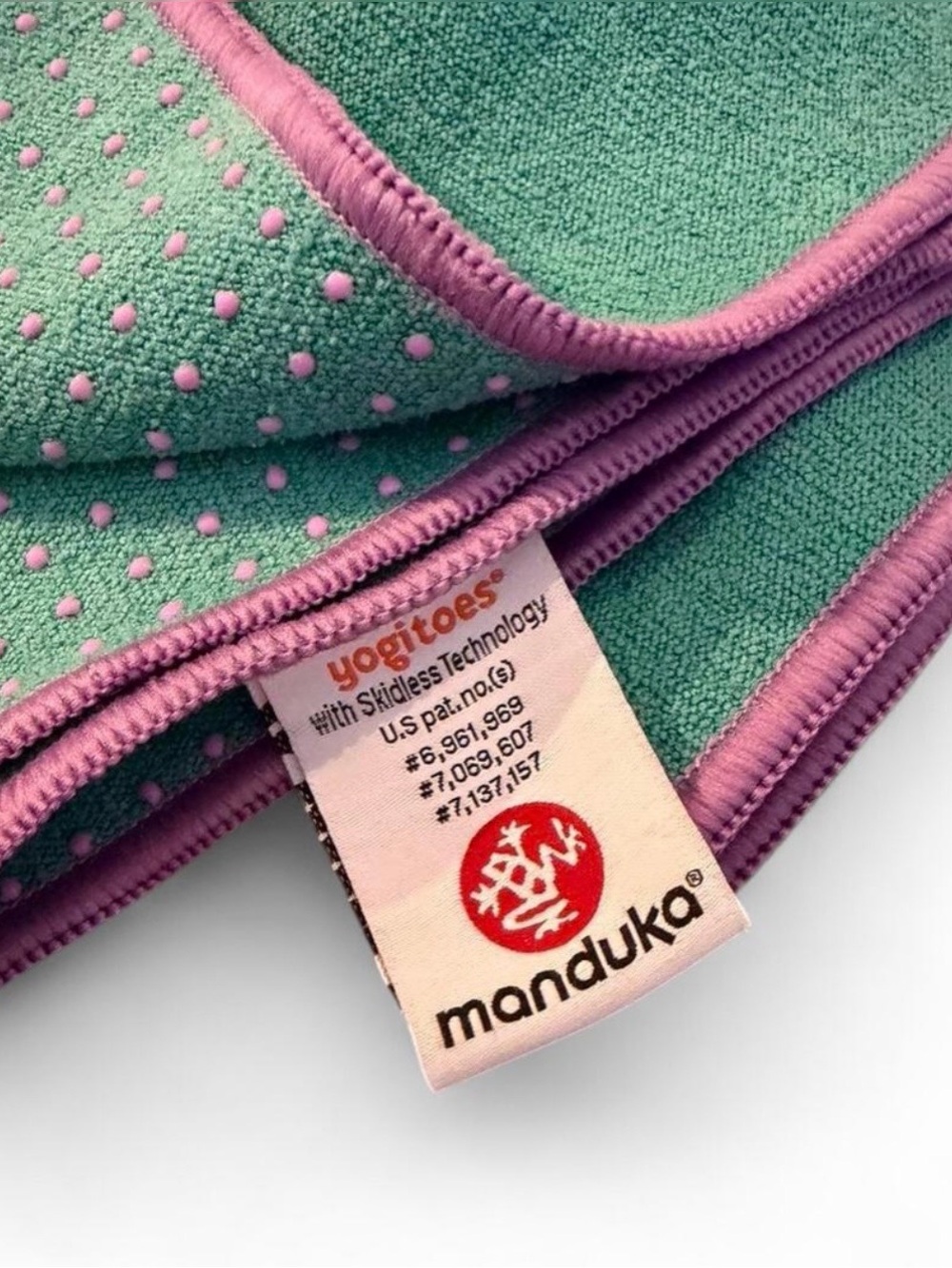 Manduka Yogitoes Yoga Mat Towel in turquoise with purple trim. Sz. 24” x 68”